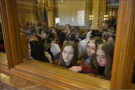  ?? PHOTOS BY HYOUNG CHANG — THE DENVER POST ?? East High School students gather at the House Chambers, asking for legislator support of gun reform, at the Captiol in Denver on Thursday. House members will debate a package of new bills on Friday.