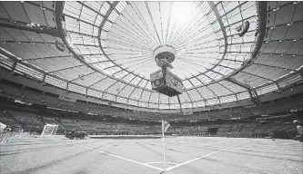  ?? DARRYL DYCK THE CANADIAN PRESS ?? Water is sprayed on the artificial turf before Switzerlan­d and Ecuador play a FIFA Women’s World Cup soccer match at BC Place stadium in Vancouver in June, 2015.