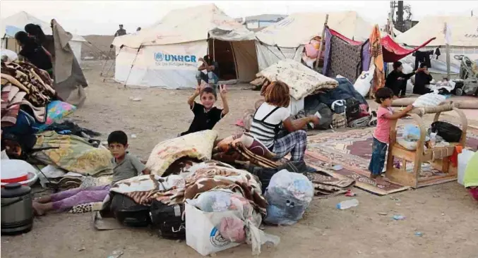  ?? Foto: Kamal Akrayi ?? Flüchtling­slager im Irak: Eine Million Kinder befanden nach Angaben der Vereinten Nationen auf der Flucht vor dem Bürgerkrie­g in Syrien.