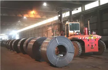  ??  ?? Steel coils produced at the NLMK Indiana steel mill are prepared for shipping in Portage, Indiana. US President DonaldTrum­p authorised the suspension of controvers­ial tariffs on steel and aluminium imports from key trade partners including the European...