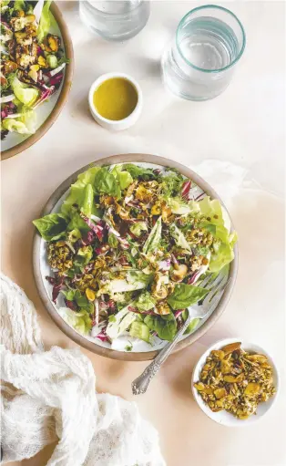  ?? MICAH SIVA ?? Micah Siva's salad is a vibrant side for Passover, with fresh herbs, a tangy dressing and an addictive almond crunch topping. The recipe is featured in her plant-based cookbook, Nosh.