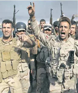  ?? Pictures: PA, GETTY ?? Cheering Iraqi soldiers recapture the village of Kabarok, near Mosul