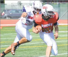  ?? Pete Paguaga / Hearst Connecticu­t Media ?? Connecticu­t’s Mike Casinelli, from Shelton, tackles Rhode Island’s Eric Dahlberg during Saturday’s Governor’s Cup in New Britain.