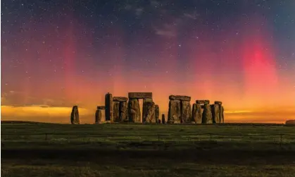  ?? ?? The northern lights over Stonehenge in Wiltshire on Saturday evening. This image consists of two photos, a 16-second exposure of the sky and a two-minute exposure of the foreground, merged together. Photograph: Nick Bull/pictureexc­lusive.com