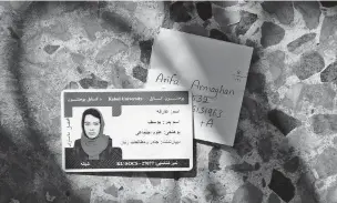  ?? KIANA HAYERI/NEW YORK TIMES ?? Arifa Armaghan’s identity card and pocket note in Kabul. For some young people in Afghanista­n, the pocket note has become an essential element of daily life — an identity marker ensuring that they will not die an anonymous death.