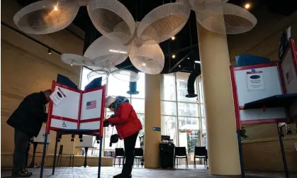  ?? Photograph: Kent Nishimura/Getty Images ?? Voters cast their ballots at a polling location at the Bennett Park Apartments Art Atrium, in Arlington, Virginia, on Super Tuesday.