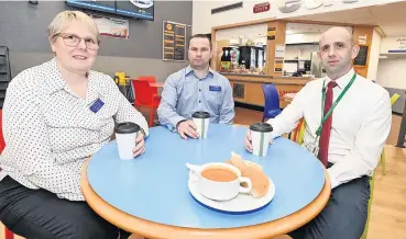  ?? ?? Warming welcome Danna Kilpatrick (Catering manager WL Leisure), Robert Taylor (area manager WLL) and Chris Nelson (Anti Poverty Service, WLC) at Bathgate Xcite Cafe