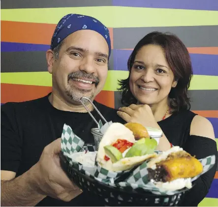  ?? DAVID BLOOM ?? Rolando Sandrea and Samanta Gonzalez at their Venezuelan restaurant, Avila Arepa, on Whyte Avenue. According to reviewer Alan Kellogg, Avila Arepa’s arrival is the best restaurant news of the year.