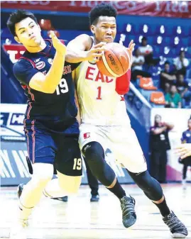  ??  ?? EMILIO Aguinaldo College’s Sidney Onwubere drives against Letran’s Bong Quinto during their NCAA game yesterday at The Arena in San Juan City. The Knights won, 84-78.