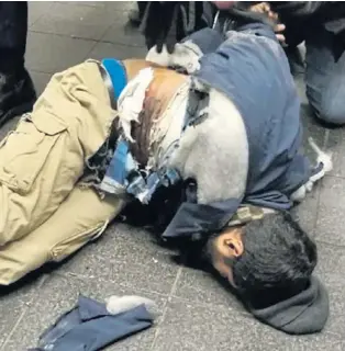  ??  ?? Suspected terrorist Akayed Ullah held on ground after police struggled with him