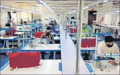  ?? SOURCED ?? People working at a garment unit in Noida SEZ on Monday. The overall strength of workers in NSEZ units is 45,000, of whom nearly 31,000 are back at work as on Saturday.