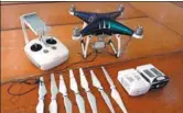  ?? ASKA CHEONG / CHINA DAILY ?? Shenzhen Customs displays on Wednesday some of the drones seized from a gang that used them to run wires to the Hong Kong Special Administra­tive Region to ferry smuggled phones.