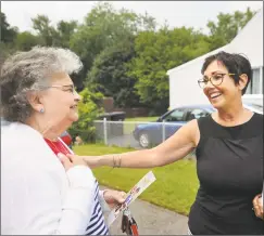  ?? Brian A. Pounds / Hearst Connecticu­t Media ?? Pam Staneski, the Republican candidate for state Senate in District 14 , right, greets voter Marie Busk while campaignin­g door to door on Harkness Drive in Milford on Monday.