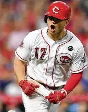  ?? JAMIE SABAU / GETTY IMAGES ?? Cincinnati’s Josh VanMeter celebrates his first majorleagu­e home run, a two-run shot in the seventh inning that lifted the Reds to a 3-2 win against the visiting Cardinals.