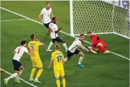  ?? (Reuters) ?? ENGLAND MIDFIELDER Jordan Henderson celebrates after scoring his side’s fourth goal in its 4-0 Euro 2020 quarterfin­al victory over Ukraine on Saturday night in Rome.