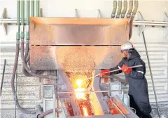  ??  ?? A worker attends to machinery at a smelter plant in a platinum mine in Zimbabwe.