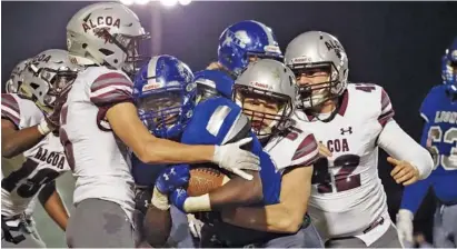  ?? STAFF PHOTO ?? Alcoa’s defense swarms to the ball during a playoff game at Red Bank in November 2020. Alcoa has shut out seven of its past eight opponents this season to return to the BlueCross Bowl and continue the bid for its seventh straight state title.