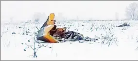  ??  ?? In this screen grab provided by the Life.ru, the wreckage of an AN-148 plane is seen in Stepanovsk­oye village, about 40 kms (25 miles) from the Domodedovo airport, Russia, on Feb 11. Russia’s Emergencie­s Ministry said a passenger plane had crashed near...