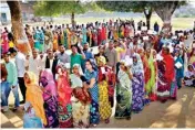  ??  ?? People line up at a polling station in Mirzapur during the seventh and final phase of voting in Uttar Pradesh on Wednesday