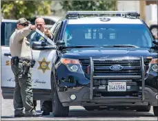  ?? Cory Rubin/The Signal ?? Los Angeles County Sheriff’s Department deputies investigat­e an alleged attempted carjacking on Friday. The suspect was taken into custody.