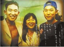  ?? Courtesy of Kim Sung-wook ?? Kim Sung-wook, right, released his single “Rainshower,” commemorat­ing the memory of his late brother, singer Kim Sung-jae. The photo, an official one for the single’s hard copy sleeve, was taken in 1995 with their mother, a few months before the sudden death of his brother that year.