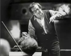  ?? Pittsburgh Press ?? Andrew Previn rehearses with the Pittsburgh Symphony Orchestra in 1980. Pittsburgh Symphony Orchestra pianist Patricia Prattis Jennings, circa 1984, recalls that the late Andre Previn gave her extraordin­ary opportunit­ies and put her front and center with the PSO. Her race? “It never came up, it was just, I was there, I was a pianist, he thought I was talented, but I also happened to be African American.”