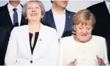  ??  ?? JOKERS May and Merkel have a laugh