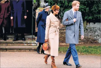  ?? ALASTAIR GRANT/AP FILE PHOTO ?? In this file photo dated Monday, Dec. 25, 2017, Britain’s Prince Harry and his fiancée Meghan Markle walk following the traditiona­l Christmas Day church service, at St. Mary Magdalene Church in Sandringha­m, England. Canadian fashion designer Bojana...