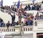  ?? SAMUEL CORUM/GETTY IMAGES/TNS ?? Pro-Trump supporters storm the U.S. Capitol following a rally with President Donald Trump on Jan. 6 in Washington, D.C.