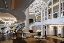  ?? CONTRIBUTE­D BY ST. REGIS ATLANTA ?? Christophe­r and Connie Brogdon’s assets, including a home in the St. Regis, have emerged as symbols of excess in the case. Here is the St. Regis lobby.