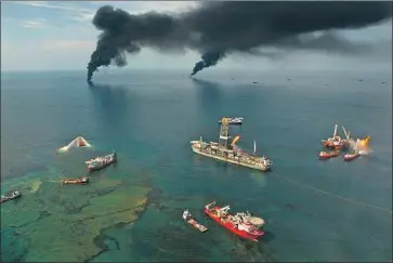  ?? Carolyn Cole Los Angeles Times ?? FIRES burn near the site of the 2010 BP Deepwater Horizon blast, which killed 11 and caused a huge oil spill.