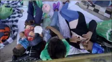  ?? Julio Cortez/Associated Press ?? Migrants rest in a gazebo at a park after a large group of deportees were pushed by Mexican authoritie­s off an area they had been staying after their expulsion from the U.S. on Saturday in Reynosa, Mexico.