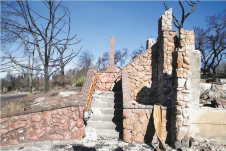  ?? Photos by Paul Chinn / The Chronicle ?? The remains of the fire-ravaged home are visible at the lot for sale at 3564 Southridge Drive in Santa Rosa.