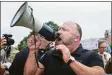  ?? Stephen Spillman / Express-News ?? Alex Jones speaks to a protesters on April 19, 2020.