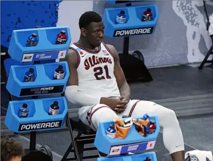  ?? MARK HUMPHREY - THE ASSOCIATED PRESS ?? Illinois’ Kofi Cockburn watches the final moments of Illinois’ loss to Loyola of Chicago in a college basketball game in the second round of the NCAA tournament at Bankers Life Fieldhouse in Indianapol­is Sunday, March 21, 2021. Loyola upset Illinois 71-58.