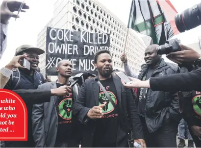  ?? Picture: Nigel Sibanda ?? ANGER. BLF founder and leader Andile Mngxitama speaks to members and media before entering the High Court in Johannesbu­rg yesterday. His organisati­on was at the losing end of the case.