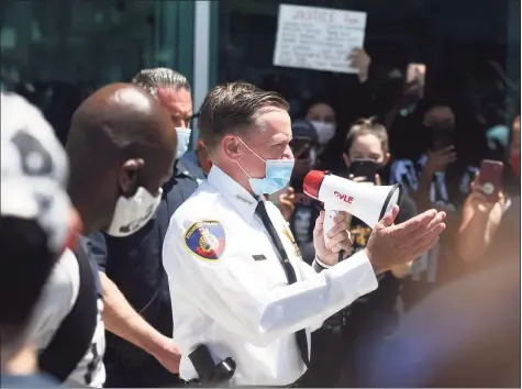  ?? Tyler Sizemore / Hearst Connecticu­t Media ?? Stamford Police Chief Tim Shaw speaks at a demonstrat­ion in front of the Stamford Police Station on May 31, 2020.