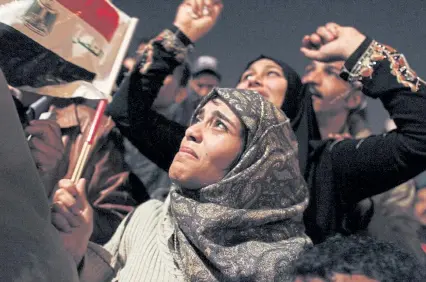  ?? Tara Todras-Whitehill, Associated Press file ?? An Egyptian woman cries as she celebrates the news of the resignatio­n of President Hosni Mubarak, who handed control of the country to the military, in Tahrir Square, Cairo, Egypt, in 2011.