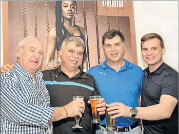  ??  ?? CHANGING OF THE GUARD: Former Springbok cyclist and Bay businessma­n Martin Nefdt, left, recently handed the reins of his Puma Sportswear agency to his son Gustav, right. Pictured, middle left and right, with the Nefdts at their new showroom in Walmer...