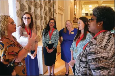  ?? Arkansas Democrat-Gazette/THOMAS METTHE ?? Meghan Ables (left), 2016 Arkansas Teacher of the Year, talks Thursday with semifinali­sts for the award after the 2019 state Teacher of the Year recognitio­n event at the Governor’s Mansion in Little Rock. Pictured (from left of Ables) are semifinali­sts Chrystal Burkes of Bryant and Candace Wilson of Sheridan; Randi House, 2018 Arkansas Teacher of the Year; and semifinali­sts Vanessa Stewart of Springdale and Stacey McAdoo of Little Rock.