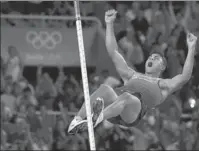  ?? MATT DUNHAM / ASSOCIATED PRESS ?? Brazil’s Thiago Da Silva celebrates after clearing the bar to set new Olympic record during the athletics competitio­ns of the 2016 Summer Olympics at the Olympic stadium on Tuesday.