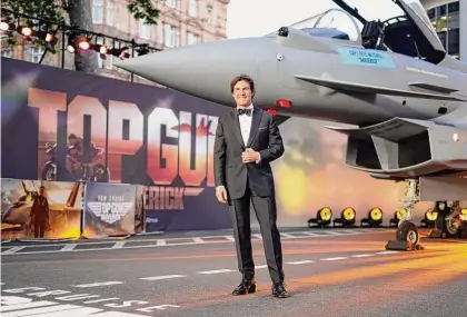  ?? Alberto Pezzali / Associated Press ?? Tom Cruise poses for the media during the “Top Gun Maverick” UK premiere at a central London cinema, on May 19. Nostalgia sells and marketers know it, having used the brands of yesteryear fully aware that consumers will willingly open their wallets to scratch that sentimenta­l itch. That winning formula is being tweaked increasing­ly to create hybrids, however, products that possess the same heartfelt recognitio­n, with a twist.