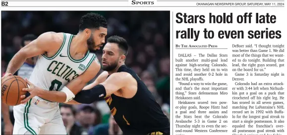  ?? Boston Celtics forward Jayson Tatum keeps the ball from Cleveland Cavaliers guard Max Strus during Game 2 Thursday in Boston. Cavs rolled 118-94 to tie the series at 1-1. ?? THE ASSOCIATED PRESS