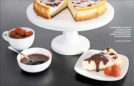  ?? SAFURA SYED PHOTO ?? A mixed berry sauce is swirled into the cheesecake before baking, with the extra served alongside.
