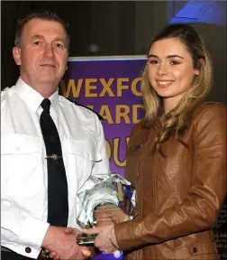  ??  ?? Loreto Wexford student Clara O’Doherty, Barntown, is presented with her award by Superinten­dent Jim Doyle.