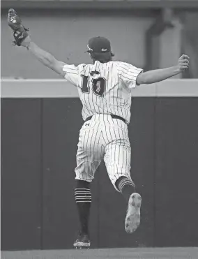  ?? CHRISTINE TANNOUS / THE COMMERCIAL APPEAL ?? Colliervil­le's Grayson Saunier (10) catches a ball during a game against Arlington on April 5at Colliervil­le High School.