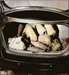  ?? Norwalk Police Department / Contribute­d photo ?? Norwalk police said officers recovered 13 catalytic converters in the trunk of a car that appeared to have been recently cut from vehicles earlier this year.