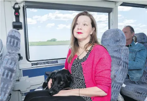  ?? PHOTOS: MICHAEL BELL ?? Cheryl Dolan, with guide dog Hudson, says the STC bus service is a necessary part of her life.