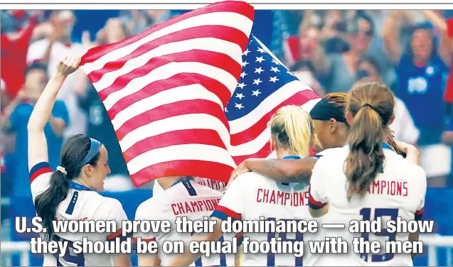  ?? UPI ?? CARRYING THE FLAG: The U.S. Women’s National Team celebrates after winning its second-straight — and fourth overall — World Cup title.