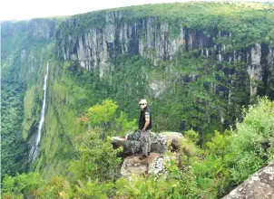  ??  ?? As a human being, you have to stop and refresh. Here a tourist enjoys the view at Nyanga National Park Lodges and camping